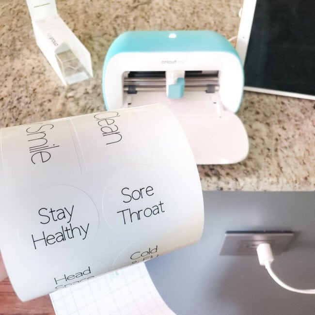 White vinyl labels with Cricut Joy in background