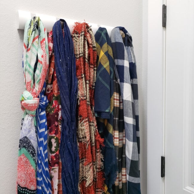 Scarves hanging on coat rack