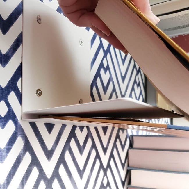 Demonstration of Putting a Book onto a metal invisible shelf