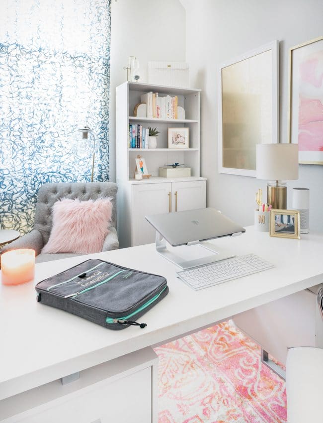 Binder labeled In Case of Emergency on white desk in feminine office