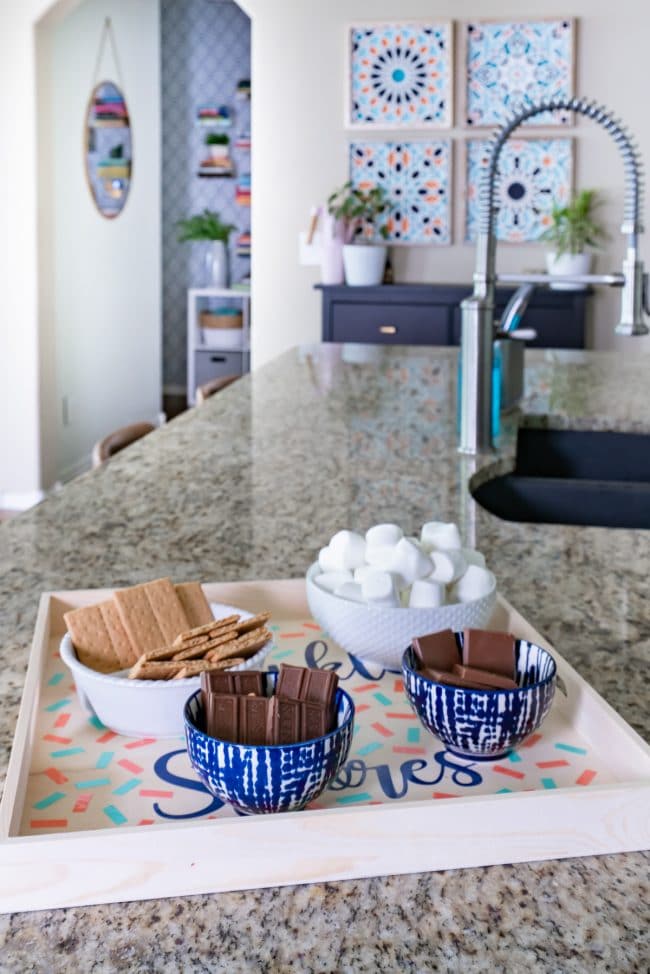 Tray of S'more ingredients in kitchen with granite countertops