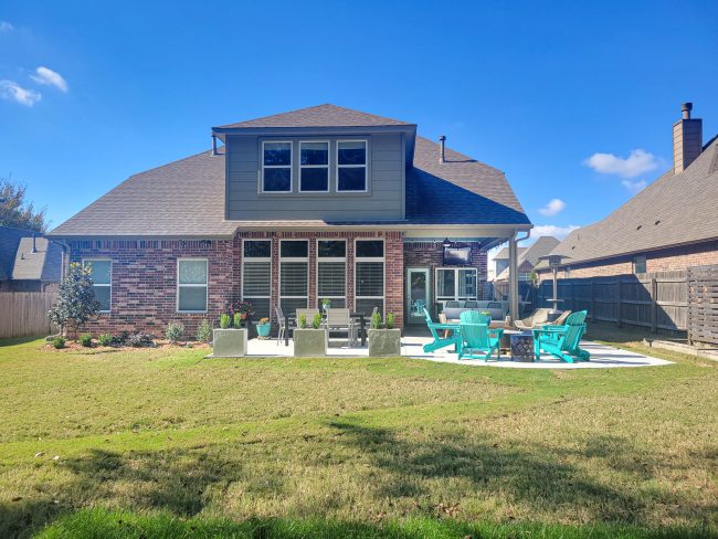 two story home with large back patio